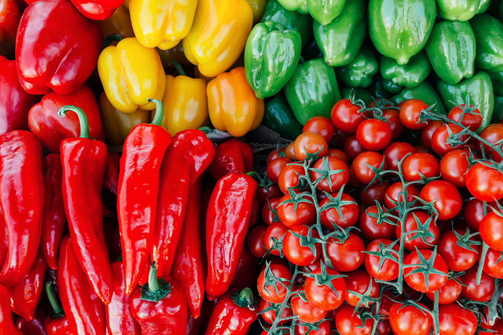 Cherry,tomatoes,and,peppers,beautifully,situated,on,a,farmer's,market