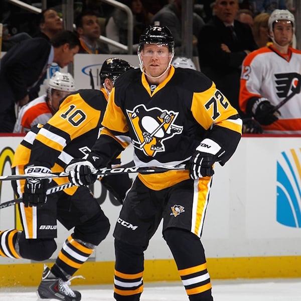 Mario Lemieux of the Pittsburgh Penguins skates with the puck as