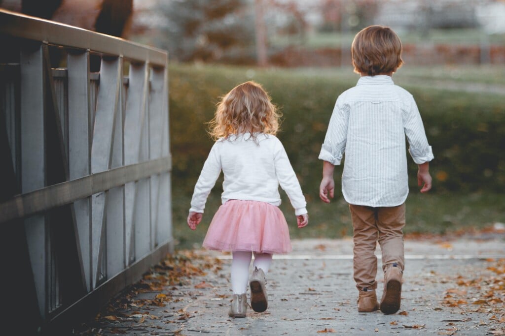 brother and sister walking without holding hands
