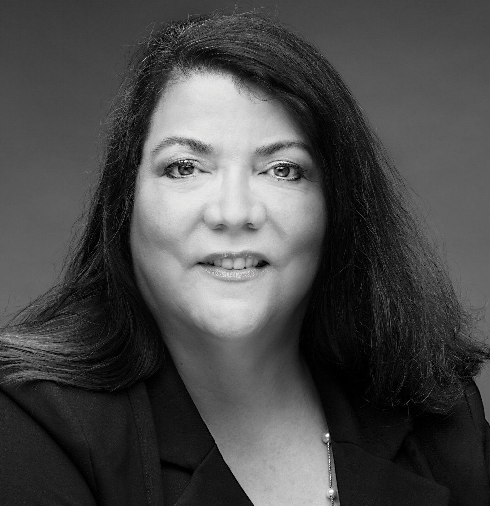 A black and white portrait of Deborah Ortiz