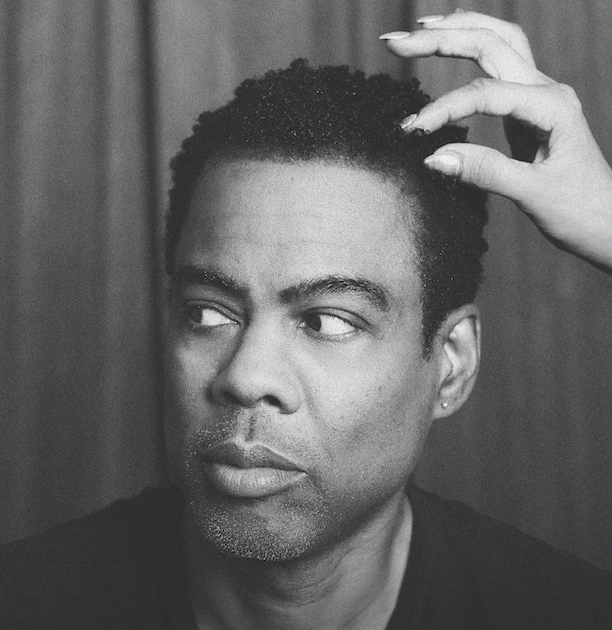 A black and white photo of Chris Rock
