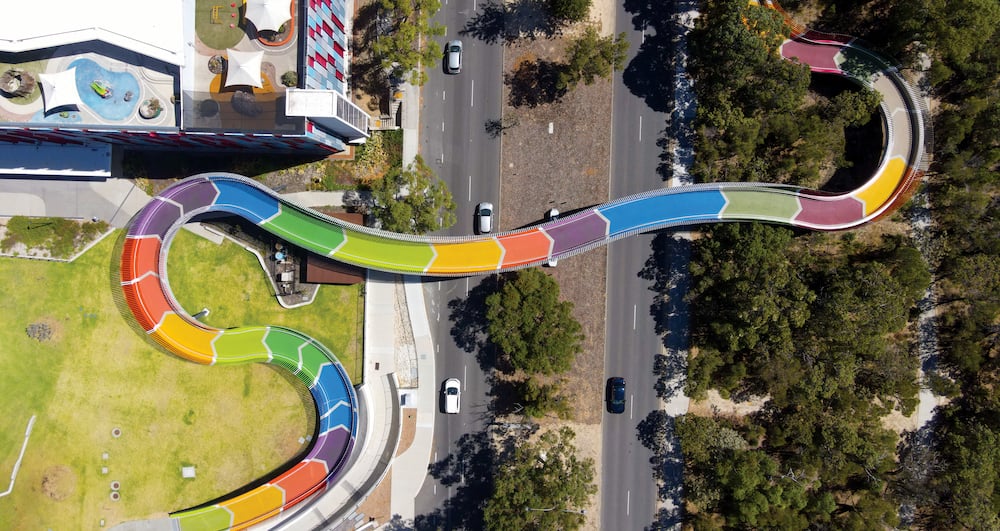 A Rainbow Bridge stretching over a highway
