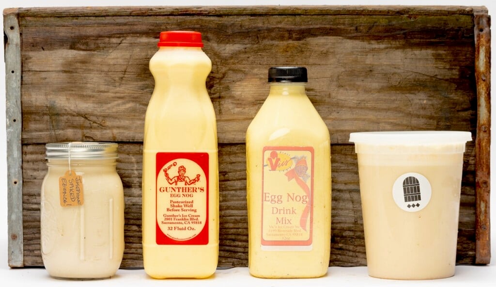 Eggnog in a mason jar from Restaurant Josephine, a tall bottle from Gunther's Ice Cream, a shorter bottle from Vic's Ice Cream, and a deli container from The Monk's Cellar