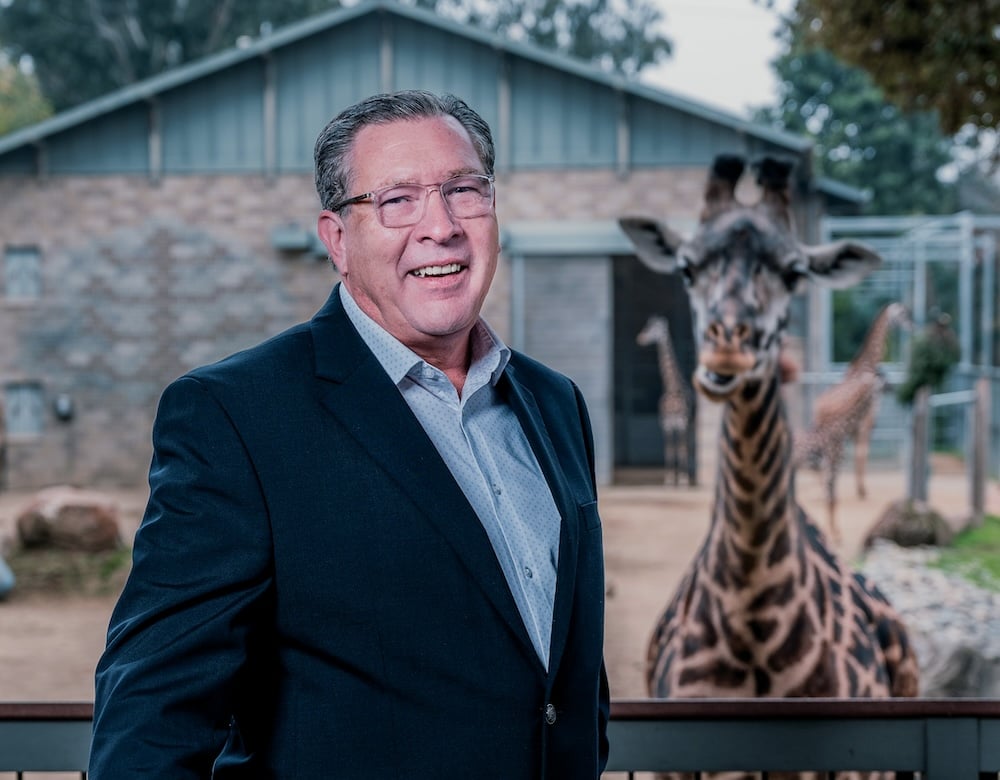 Dan Simon, the new director of the Sacramento Zoo, poses for a portrait at Giraffe Viewing Deck