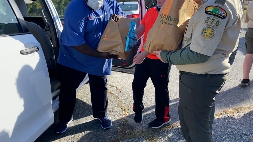 Boy Scouts Giving Food