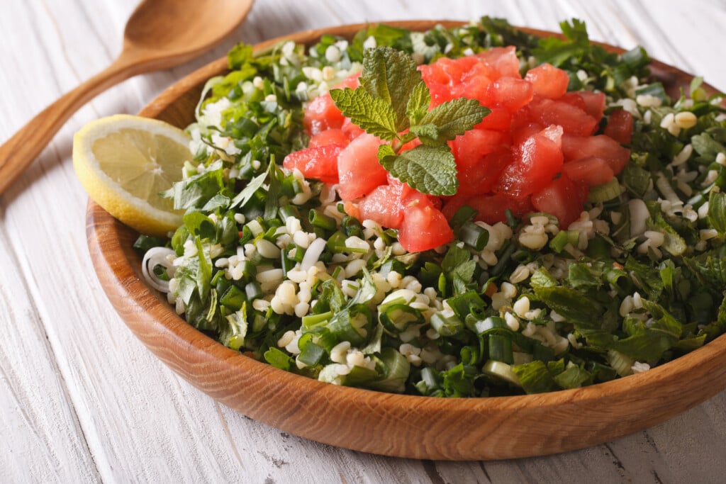 Dietary Tabbouleh Salad Closeup In A Wooden Bowl. Horizontal