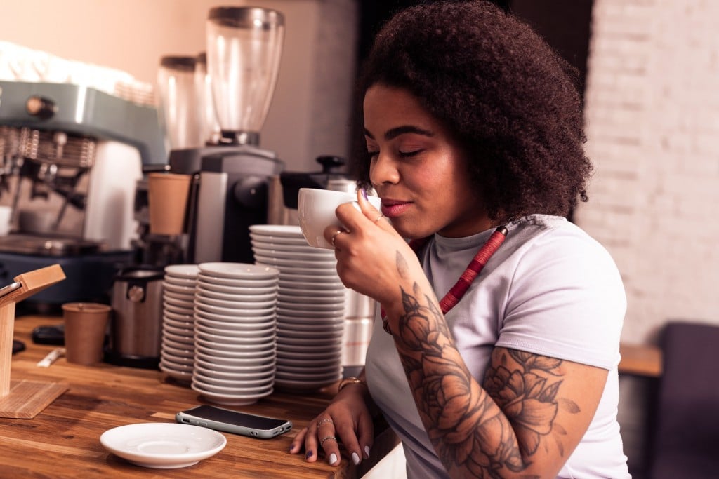 Nice Afro American Woman Smelling Her Coffee