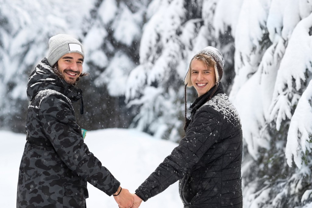 Young Man Couple Walking In Snow Forest Outdoor Guys Holding Hands