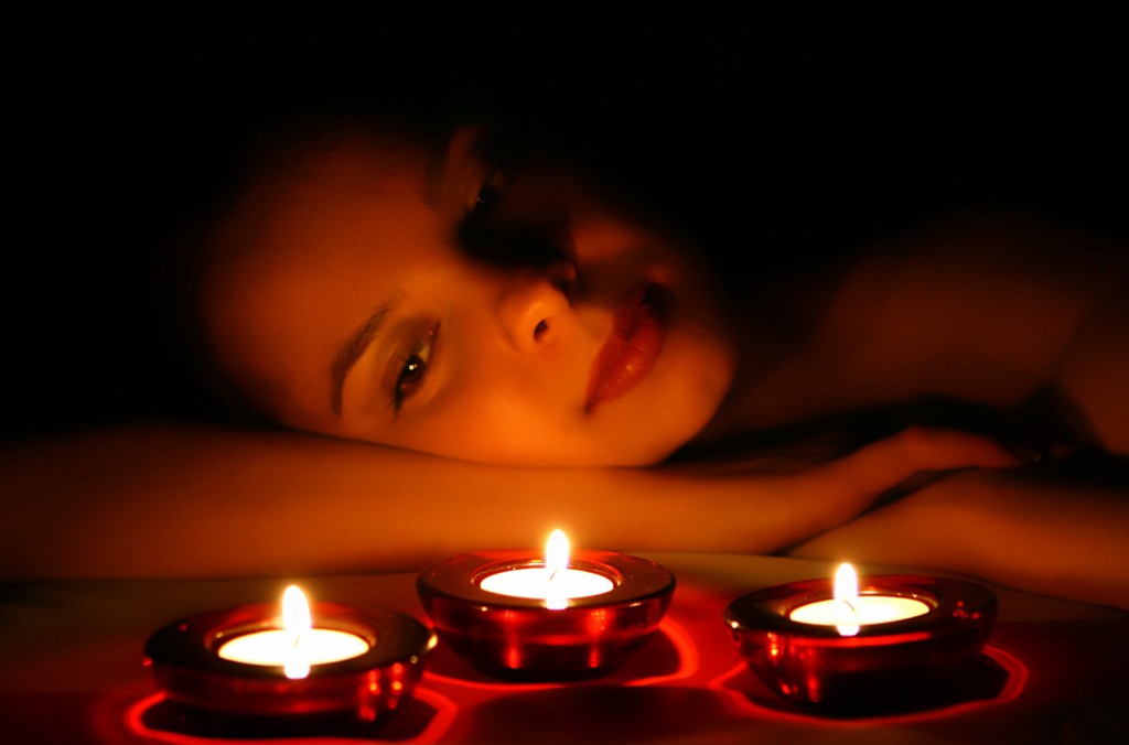 Woman Looking On 3 Candles