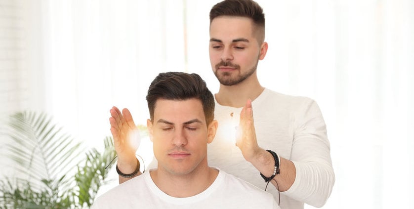 Man During Healing Session In Therapy Room