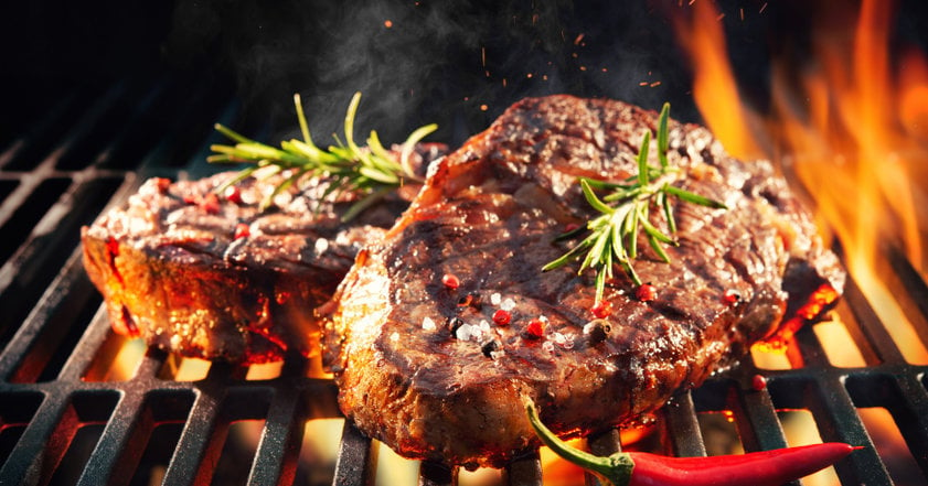 Beef Steaks Sizzling On The Grill
