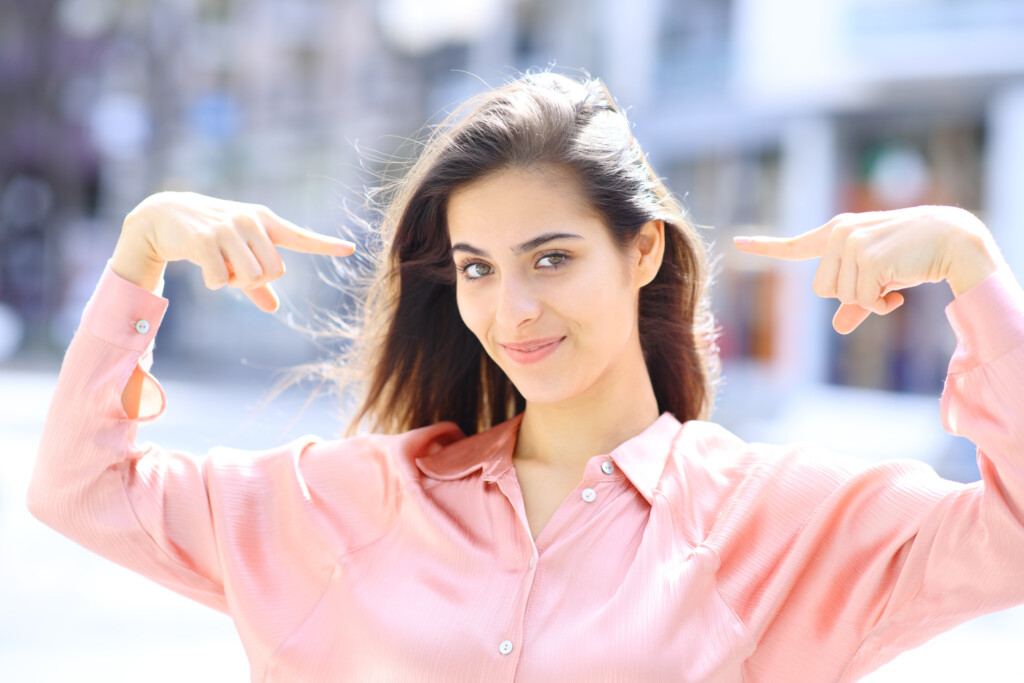 Proud Elegant Woman Pointing Herself