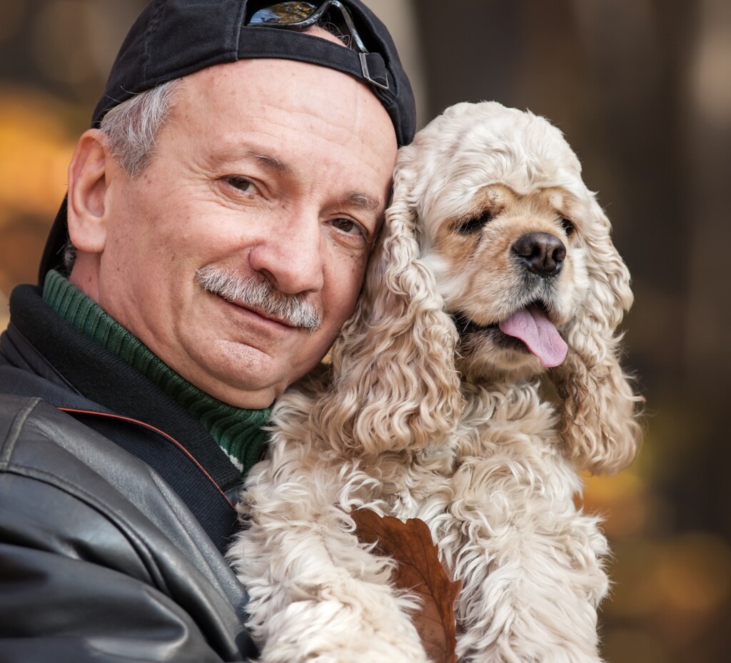 Old Man With Dog In The Forest