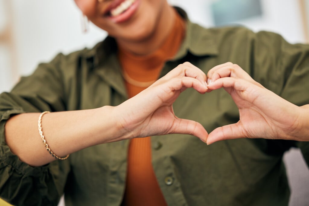 Woman, Heart And Hands Closeup For Care, Kindness And Emoji For Charity, Peace And Wellness. Happy Female Person With Finger Shape For Self Love, Thank You And Trust Of Hope, Support Sign And Icon