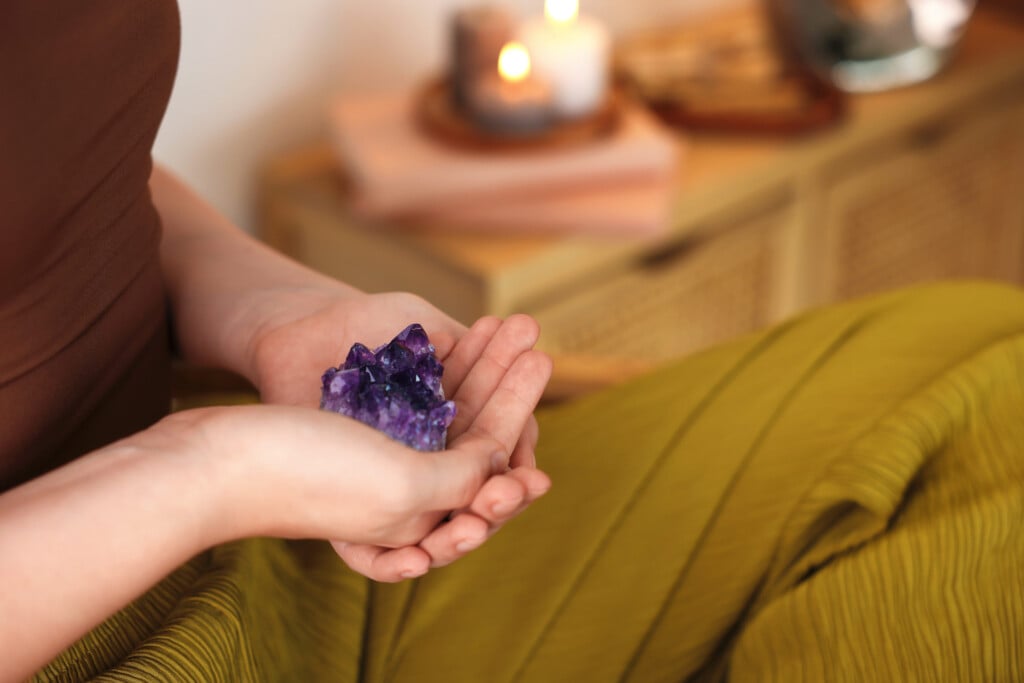 Woman With Beautiful Amethyst Gemstone Indoors, Closeup