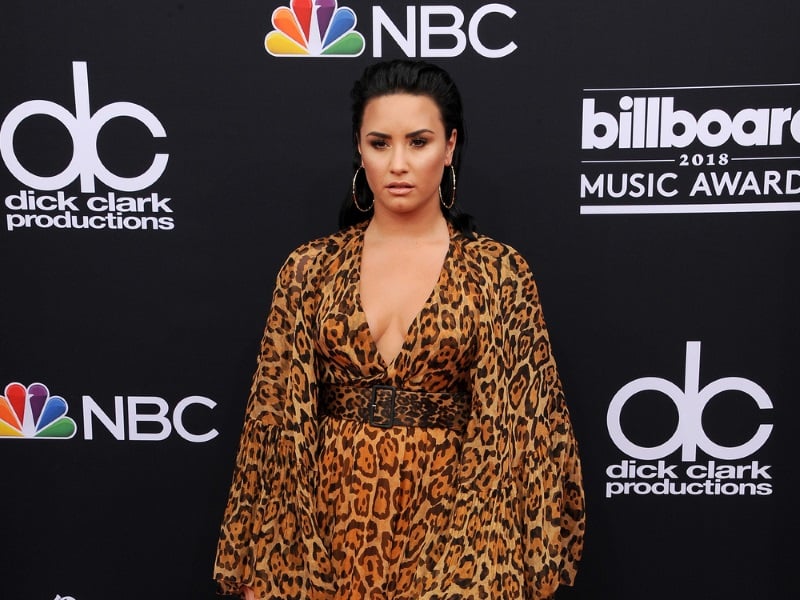 Demi Lovato's 'offensive to Christians' album posters banned, shows  crucifix and bondage