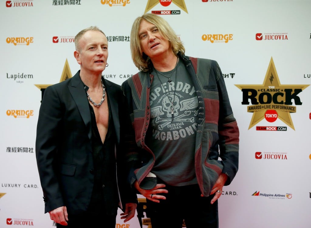 Def Leppard Lead Singer Joe Elliott (r) And Lead Guitarist Phil Collen Pose On The Red Carpet At The 2016 Classic Rock Roll Of Honour Awards In Tokyo