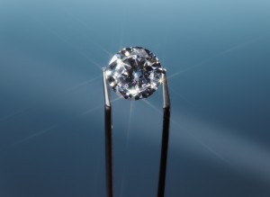 Tweezers Holding Diamond, Close Up