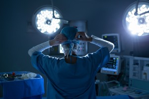 Female Surgeon Wearing Surgical Mask In Operating Room Of Hospital