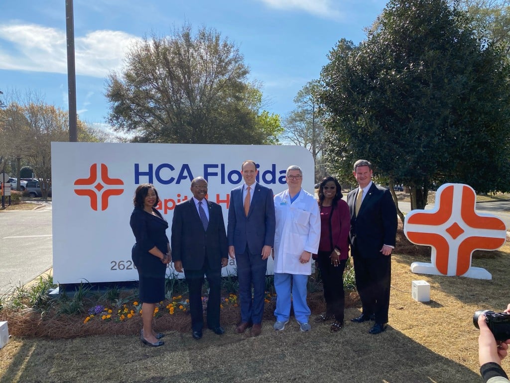 HCA Healthcare leaders with new signage