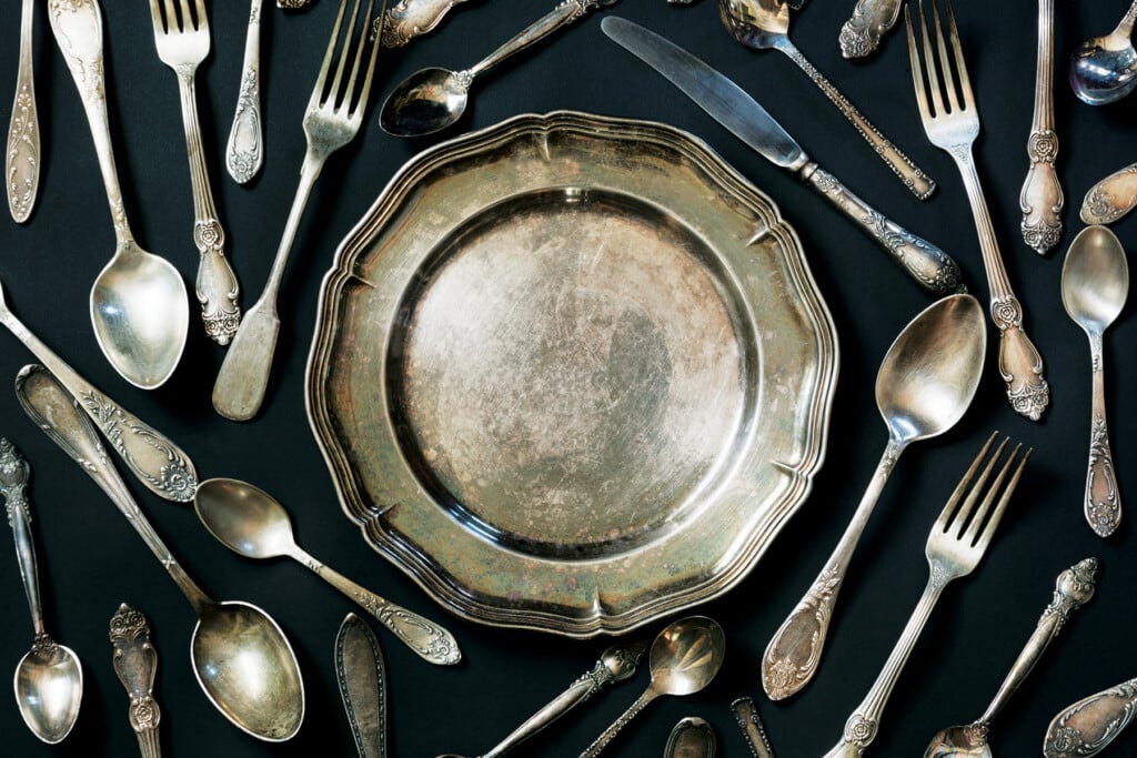 Plate, Spoons, Forks, Knives, Silverware Pattern On Black Backgr