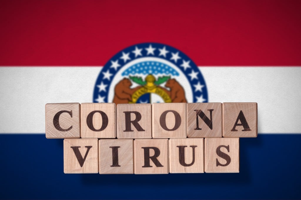 Flag Of The State Of Missouri With Wooden Cubes Spelling Coronavirus On It. 2019 2020 Novel Coronavirus (2019 Ncov) Concept, For An Outbreak Occurs In Missouri, Us.