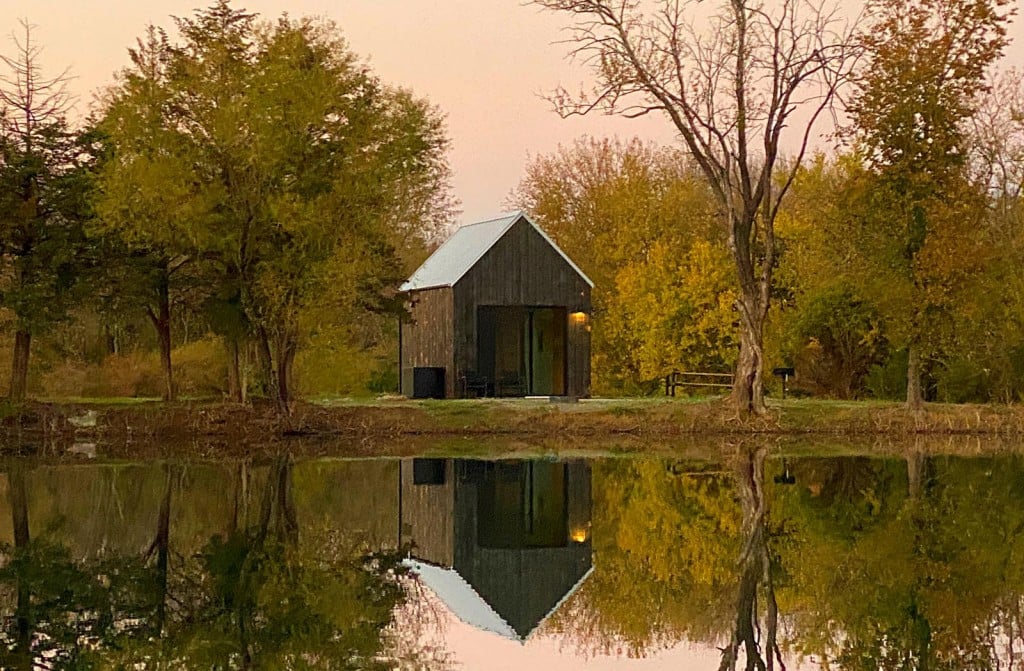 Photo of a cabin on the water at Base Camp in Humboldt, Kansas.
