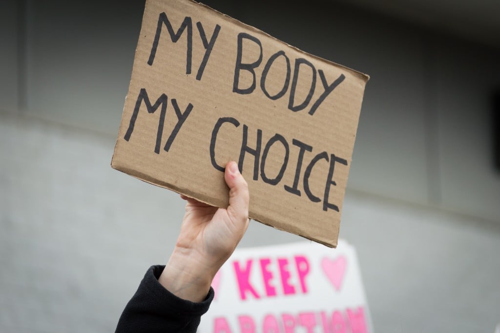 Pro Choice Planned Parenthood Demonstration Holding A Sign