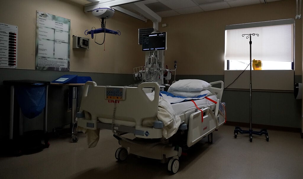 An empty ICU bed waits for a patient to arrive on Sunday, Nov. 23, at SSM Health St. Joseph Hospital in Lake Saint Louis, Mo. St. Joseph has had to expand their COVID-19 unit to other branches of the hospital since their ICU hit its capacity. // Photo by Armond Feffer