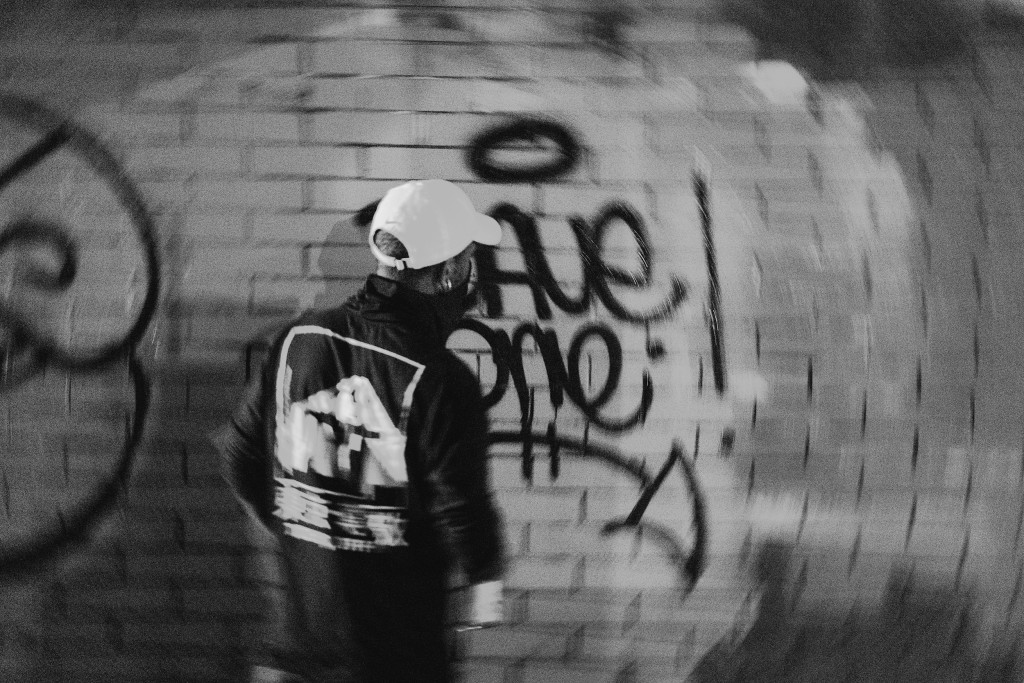 Dave One putting his tag on a wall