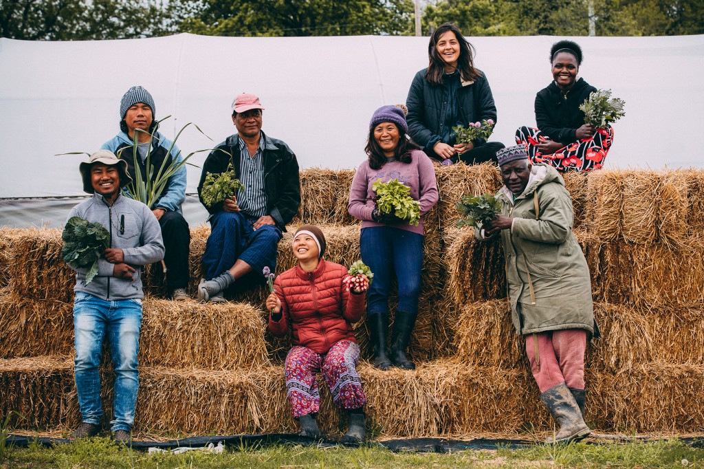 A group photo of some farmers in the New Roots for Refugees program