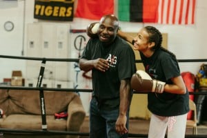 Coach Courtney and his daughter Brijhana Epperson train at their home gym in Independence, Missouri. // Photo by Chase Castor