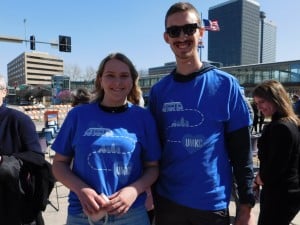 UMKC students Abigail Weiler (L) and Ted Reinhardt (R) post with streetcar extension shirts. // Photo by Savannah Hawley