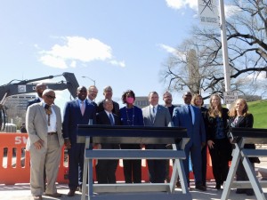 FTA members, as well Mayor Lucas, pose with the streetcar track. // Photo by Savannah Hawley