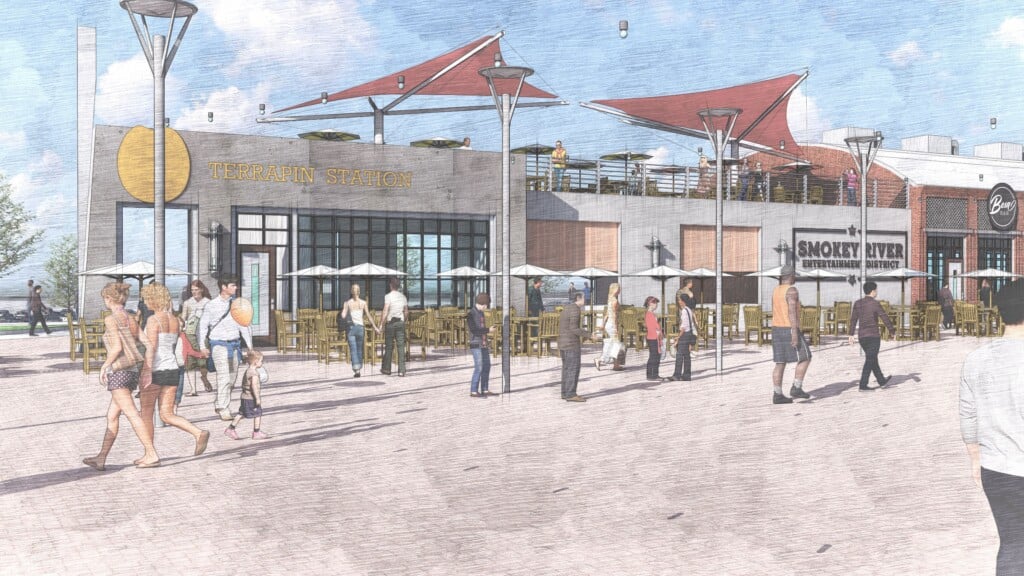 An artistic rendering shows people walking along the outdoor ampitheater and vendor village at the planned Smokey River Entertainment District.