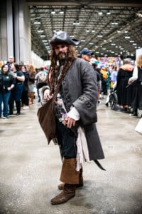 A Cosplayer Dressed Up As Captain Jack Sparrow At Planet Comicon Kansas City 2023