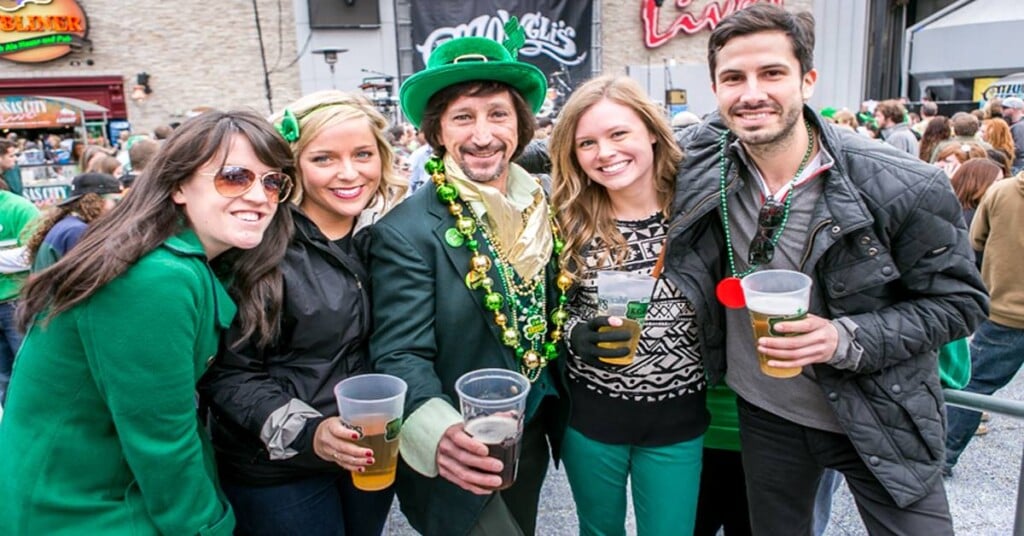 People drink beer in St. Patrick's day attire