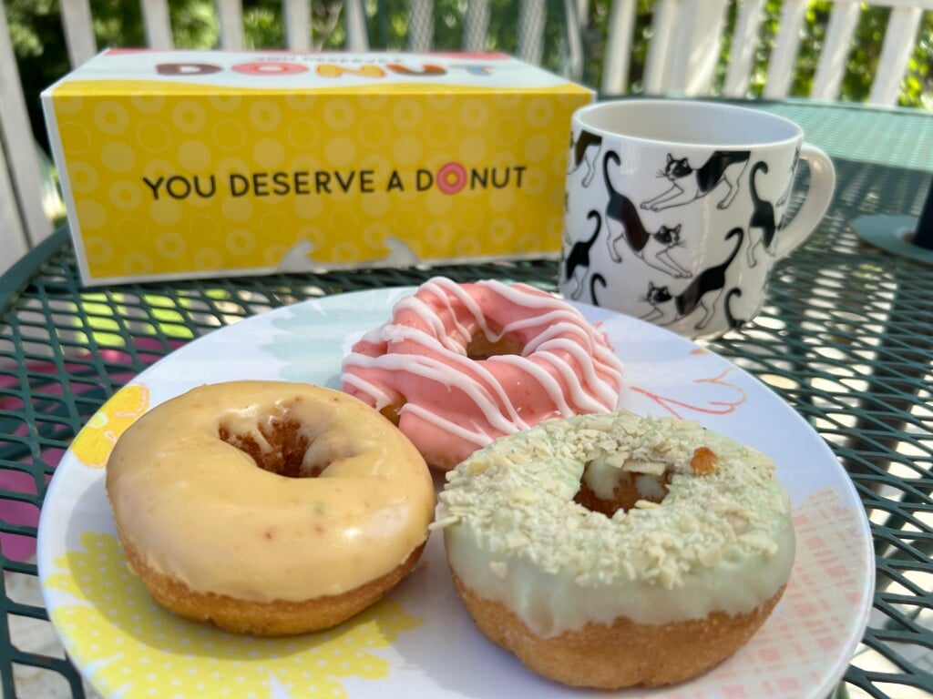 Orange Zest Raspberry Old Fashioned And Pistachio Almond From Hanas Donuts