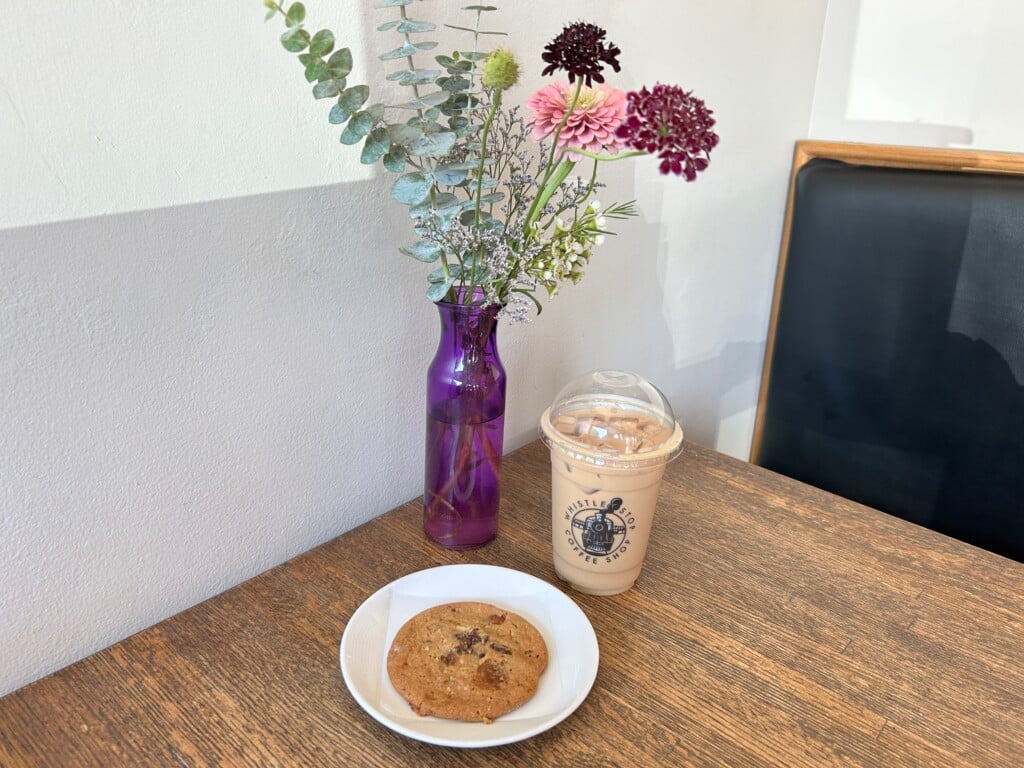Rosemary Pistachio Iced Latte And Salted Caramel Chocolate Chip Cookie At Whistle Stop Coffee Mercantile Horizontal