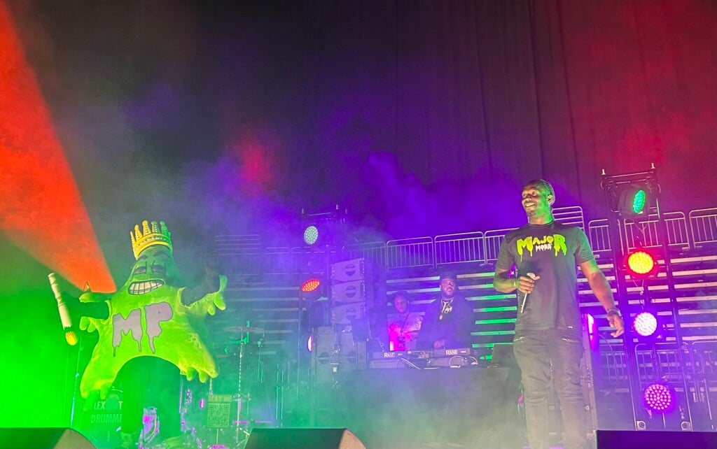 Macmo Green And Majorpac Mascot On Stage At T Mobile Center