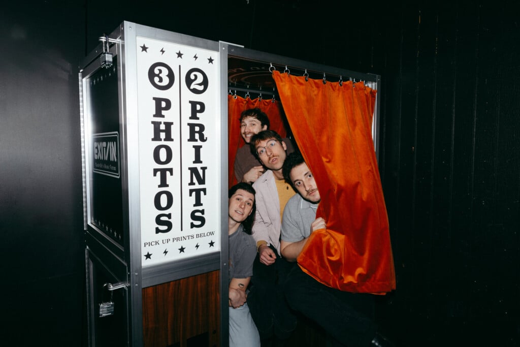 Post Sex Nachos pops out of a Photo Booth.