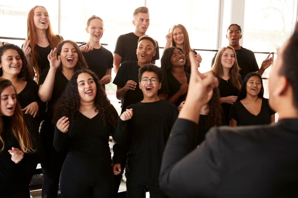 students singing in choir, for article on tulsa youth opera
