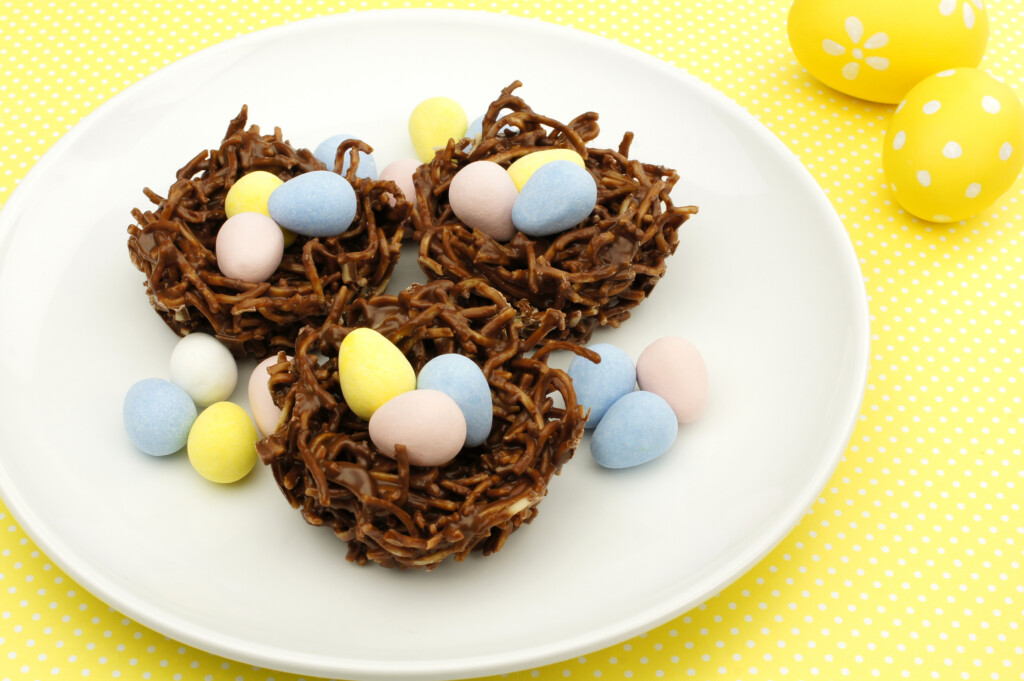 Springtime Chocolate Nests Filled With Easter Eggs On Yellow