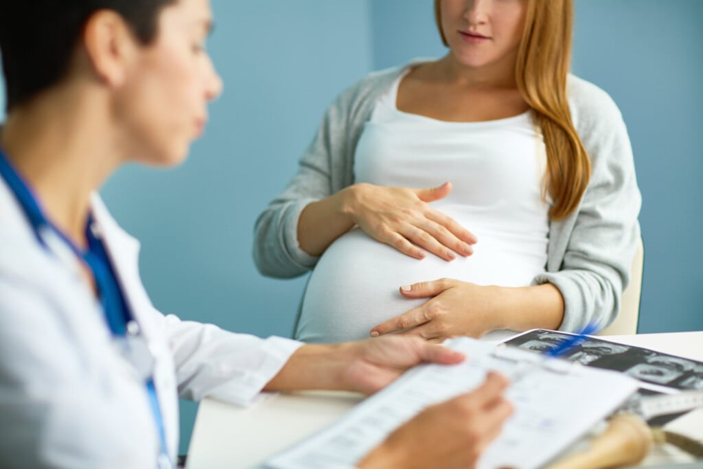 a pregnant woman visiting OB/GYN