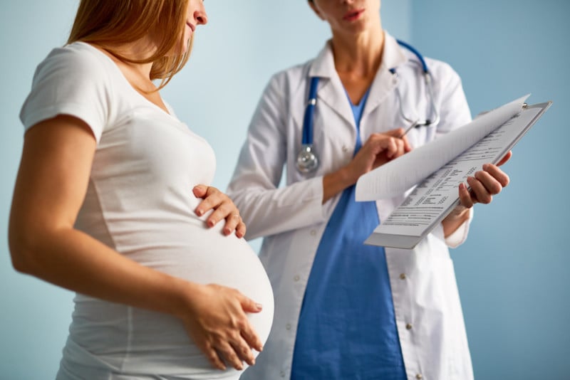 pregnant woman doing prenatal tests with a doctor