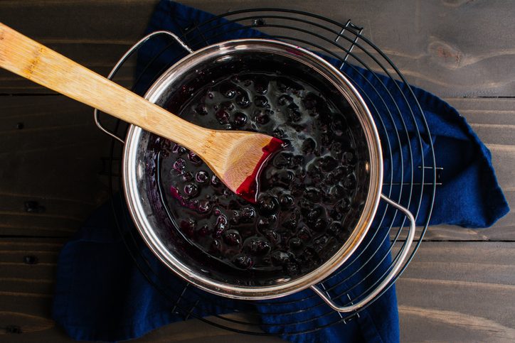 Homemade Blueberry Compote In A Small Pot With A Wooden Spoon