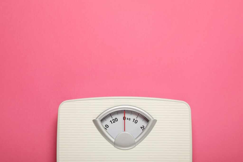 Weigh Scales On Pink Background, Top View With Space For Text. Overweight Concept