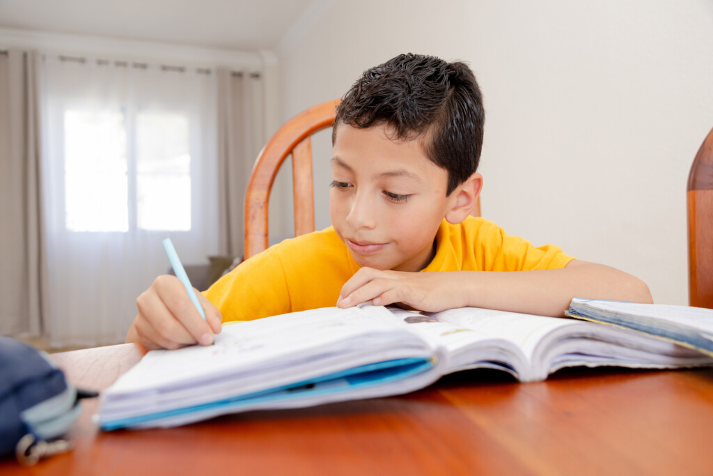 elementary aged boy doing homework