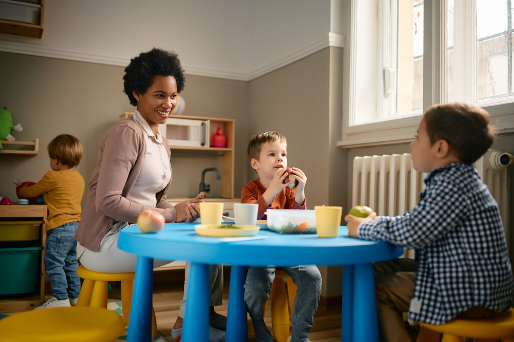 a teacher and students in an at home daycare