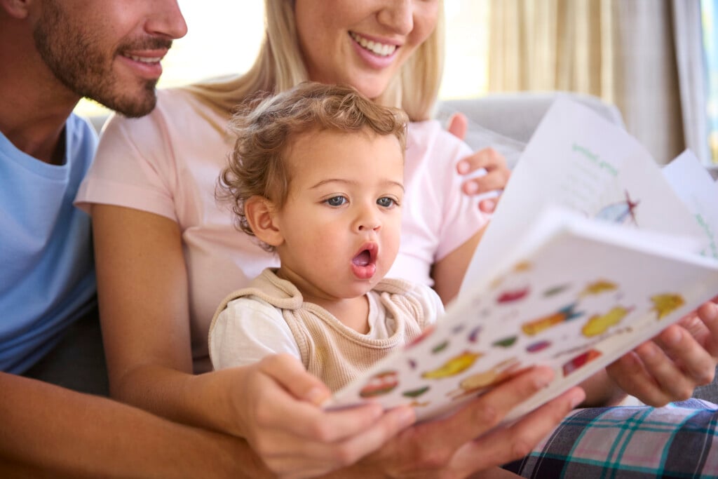 family reading to infant